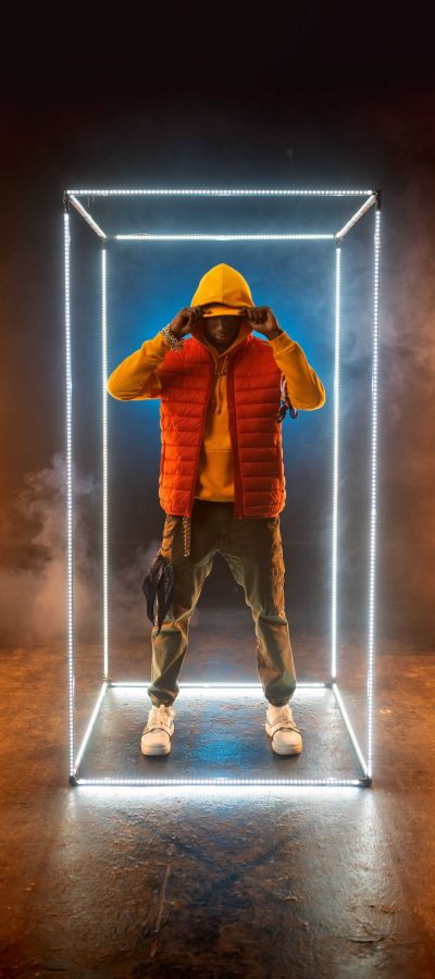 stylish-rapper-poses-in-illuminated-cube-BCRQ2AT.jpg